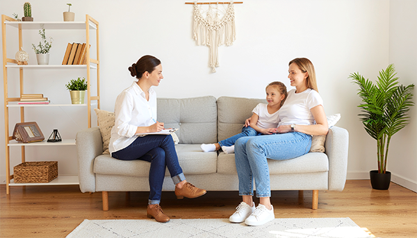 In-Person Therapy Office – Northern Sky Psychology Therapist meeting with child and caregiver in a calm office, reflecting in-person mental health support in Northern Arizona.